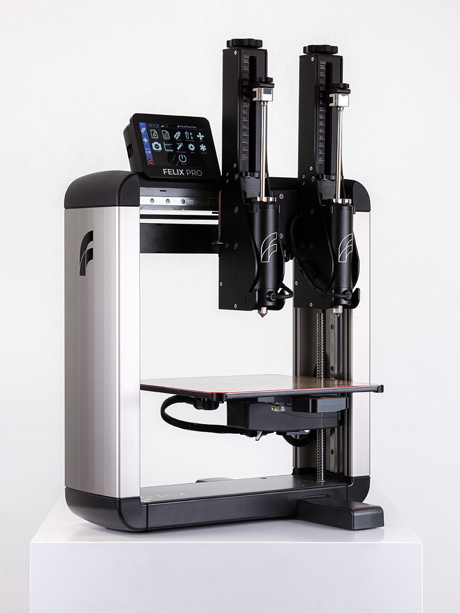 	Felix TwinHead 3D food printer with dual premium steel syringes, angled mid-shot – precision dual-object food printing