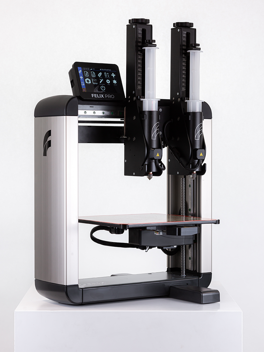 Felix TwinHead 3D food printer with dual plastic basic syringes, angled mid-shot – simultaneous dual-object food printing