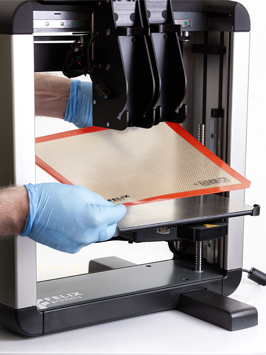 Placing silicone baking mat on build plate – non-stick surface for effortless release of edible prints